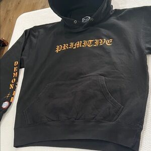 Demon slayer x Primitive Black Hoodie with Bold Orange Accents